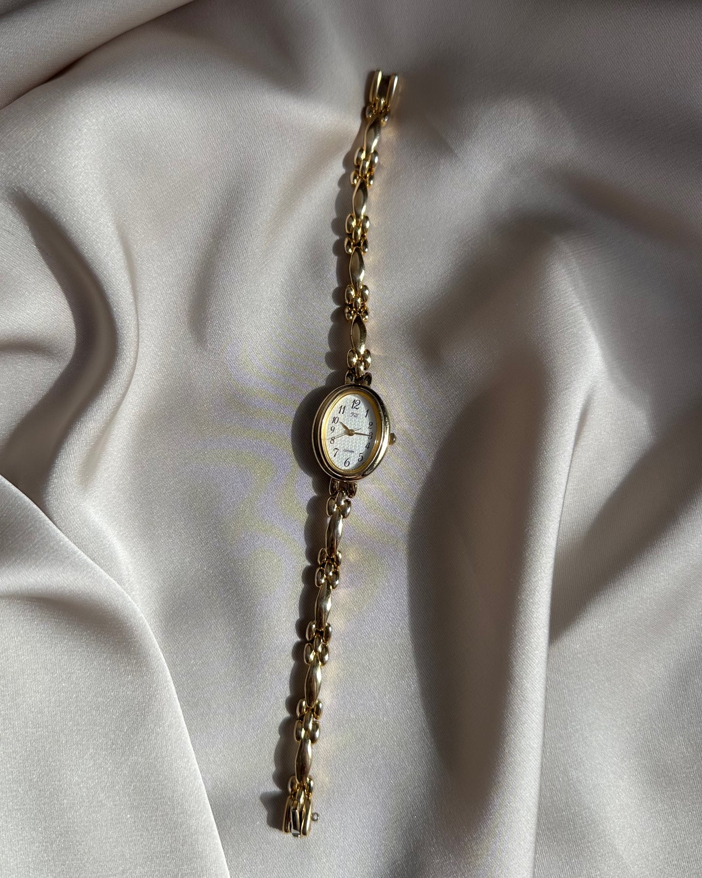 Regal Oval Slim Gold Tone Watch by Citizen
