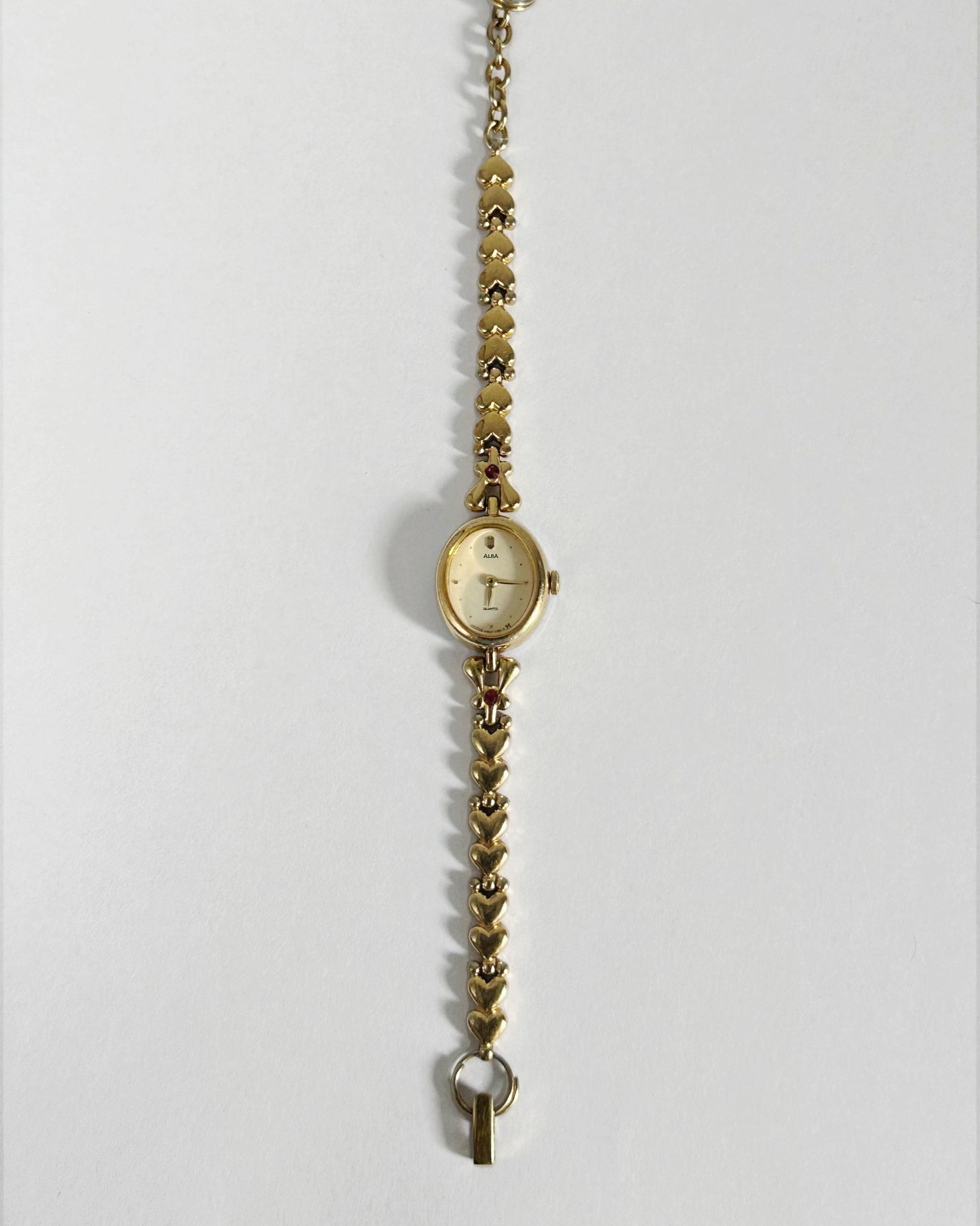 Dainty Alba Gold-Tone Bracelet Watch with Red Gem Accents