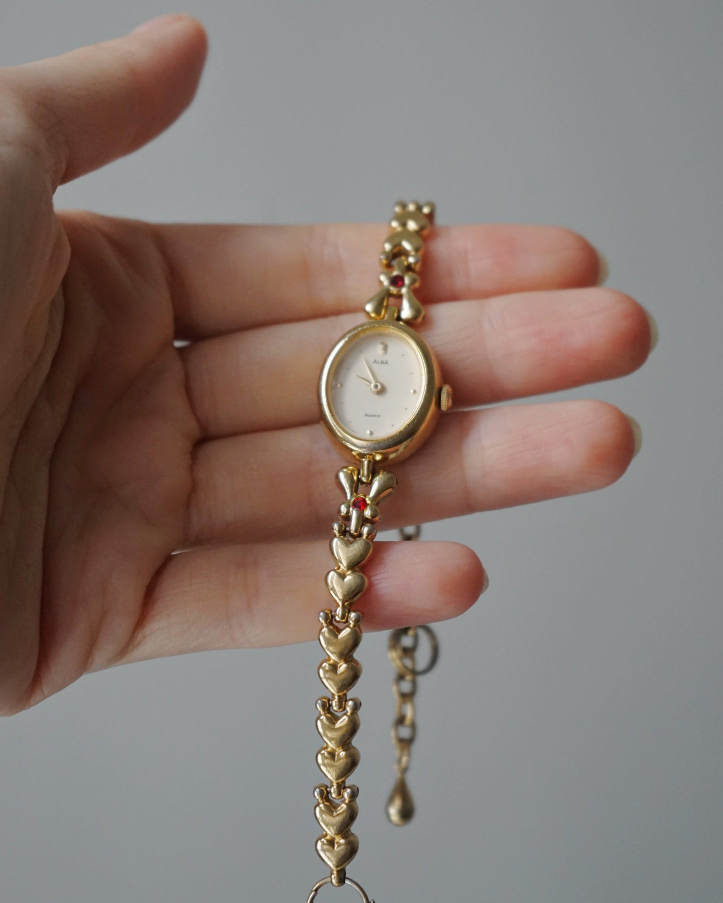 Dainty Alba Gold-Tone Bracelet Watch with Red Gem Accents