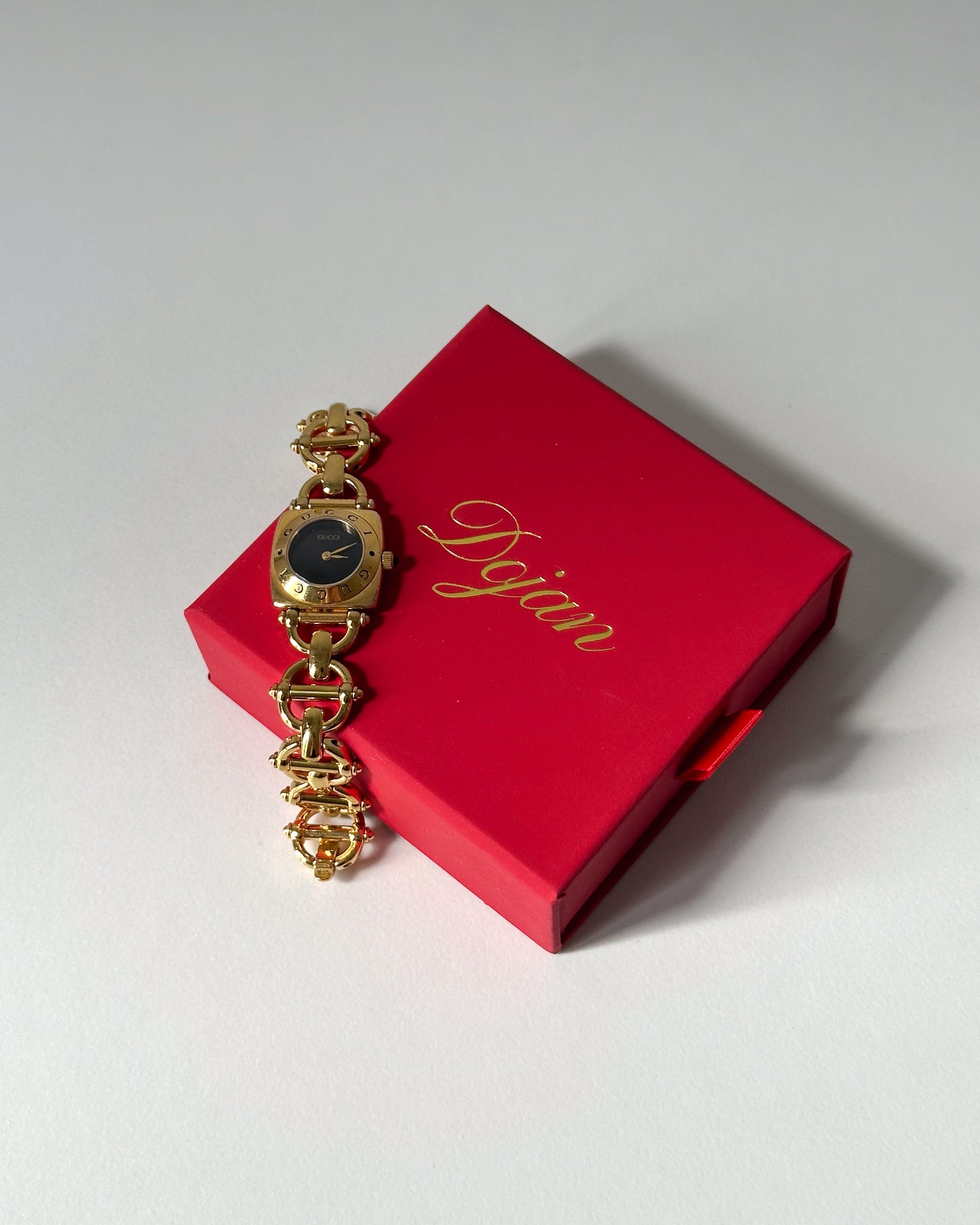 Vintage gold and black dial Gucci watch