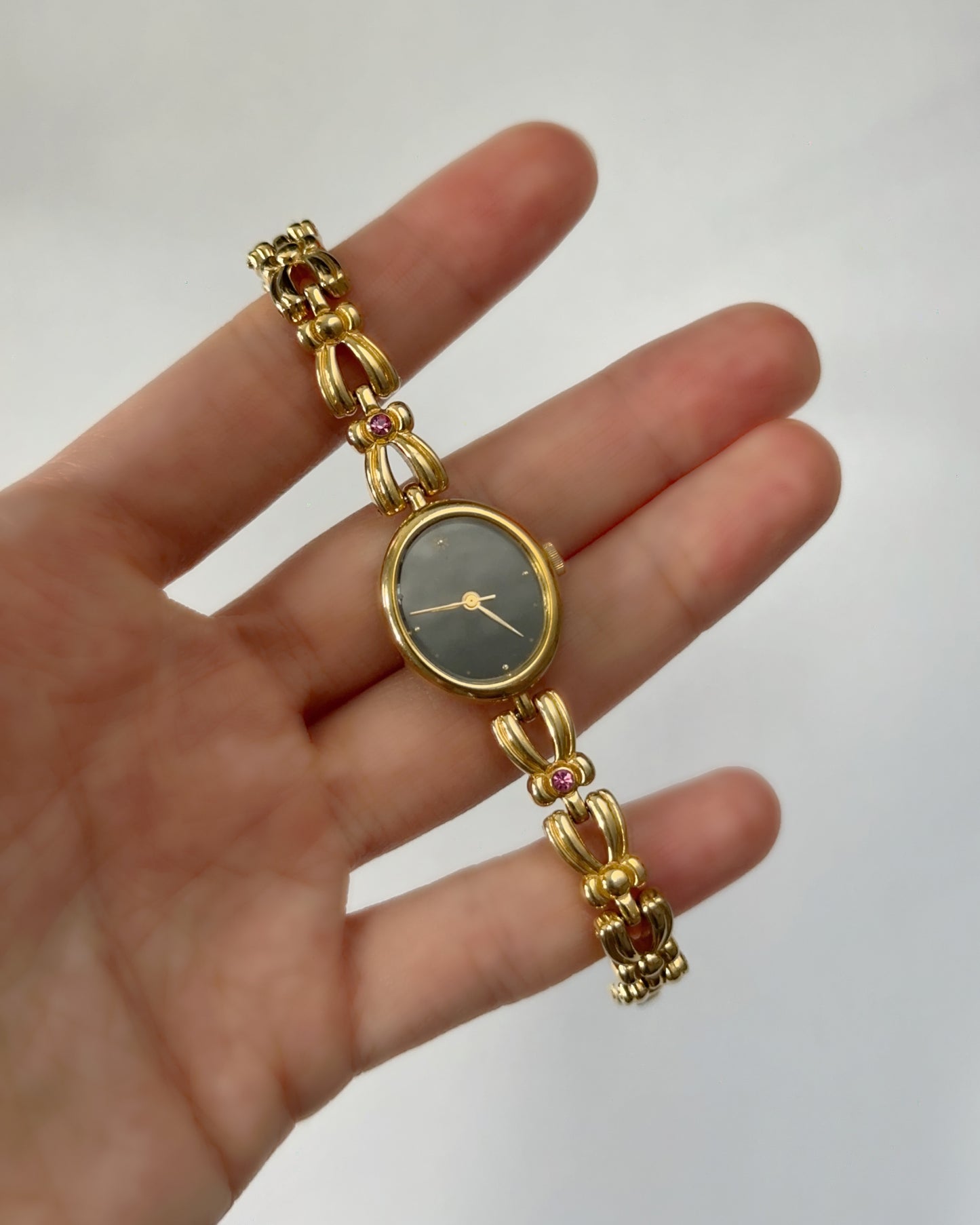 Jupiter vintage gold tone oval watch with pink gems
