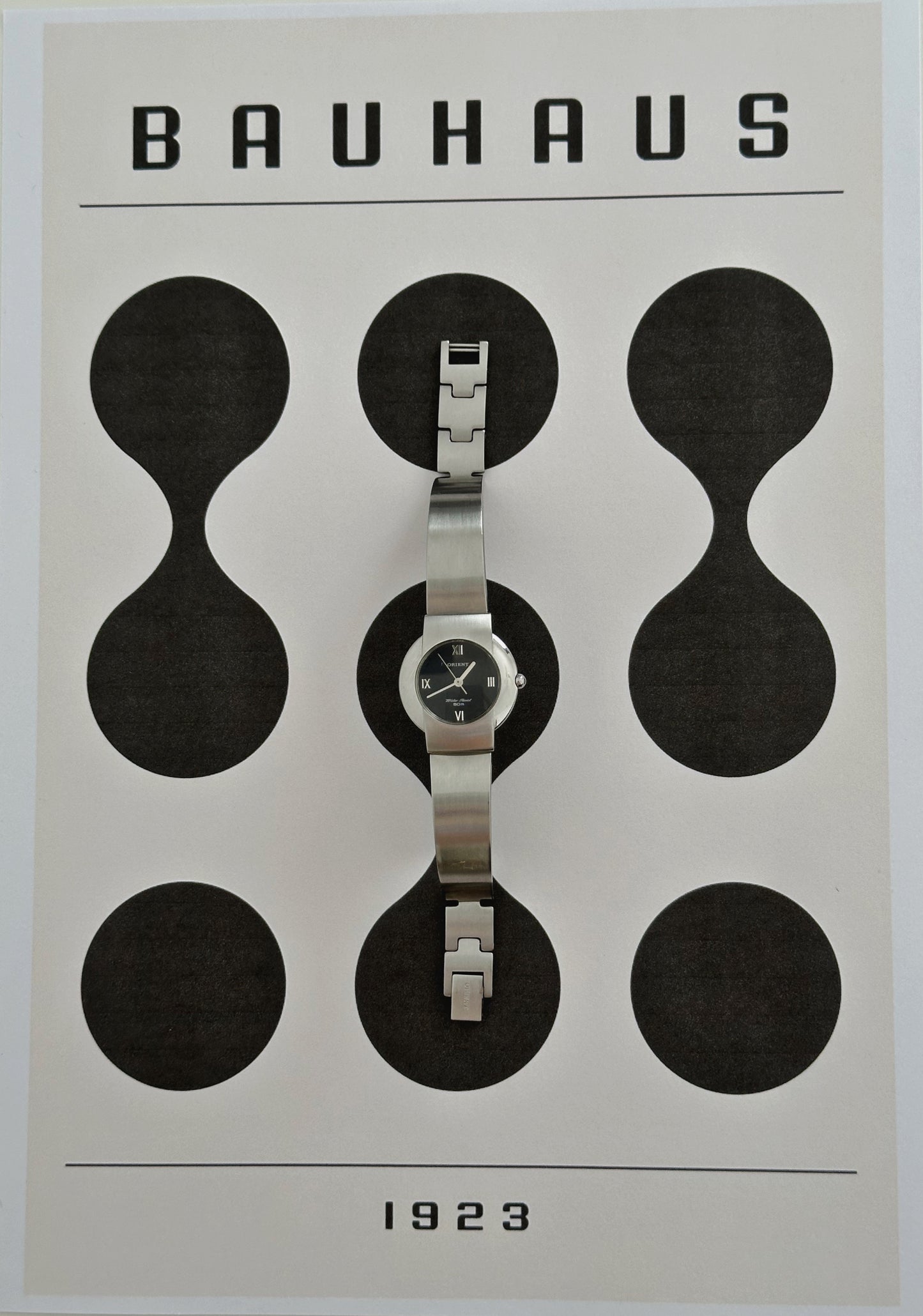 Silver tone Orient round dial watch bauhaus style