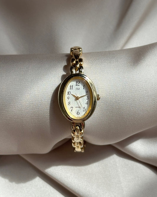 Regal Oval Slim Gold Tone Watch by Citizen