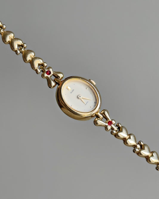 Dainty Alba Gold-Tone Bracelet Watch with Red Gem Accents