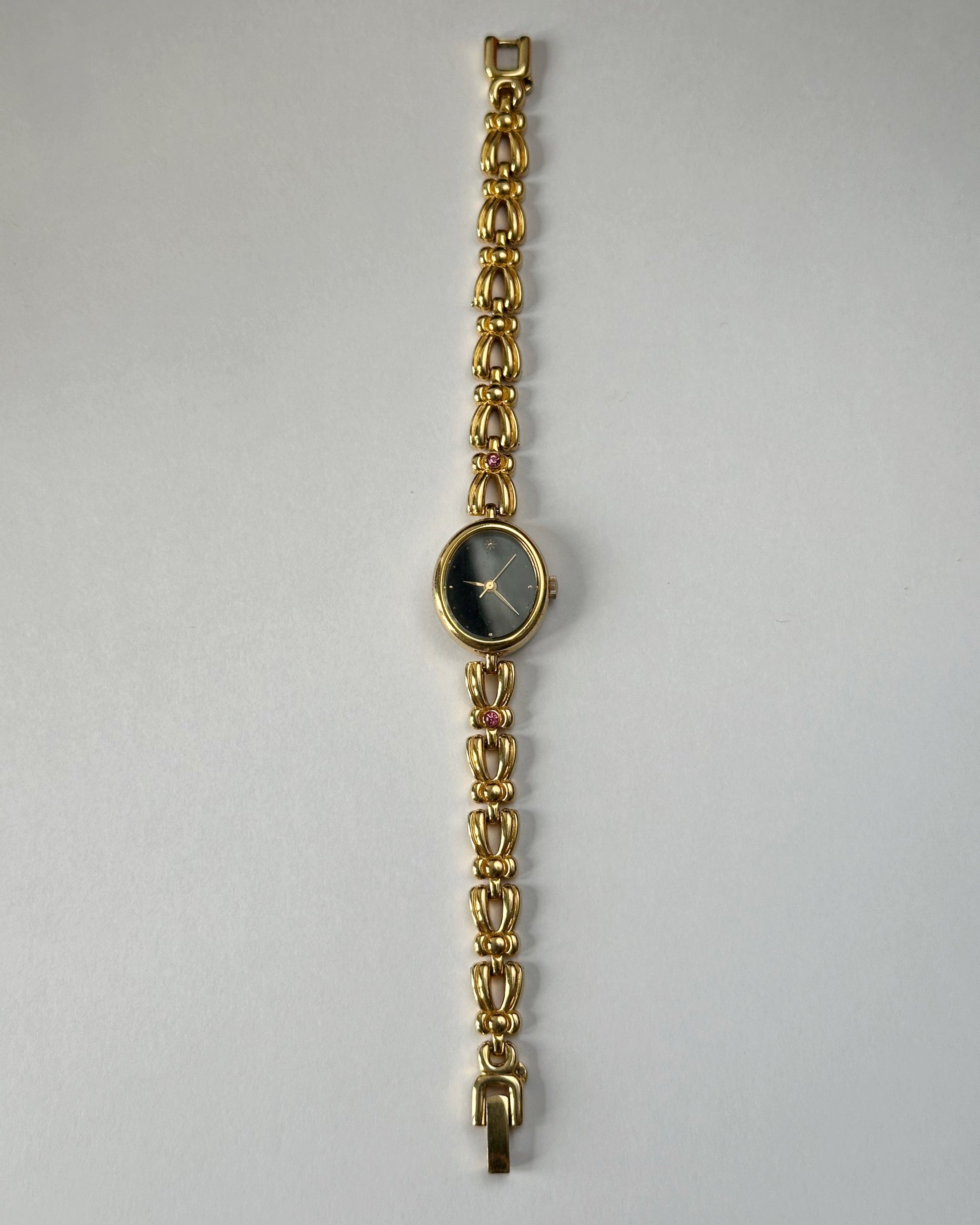 Black dial gold tone vintage watch by Orient