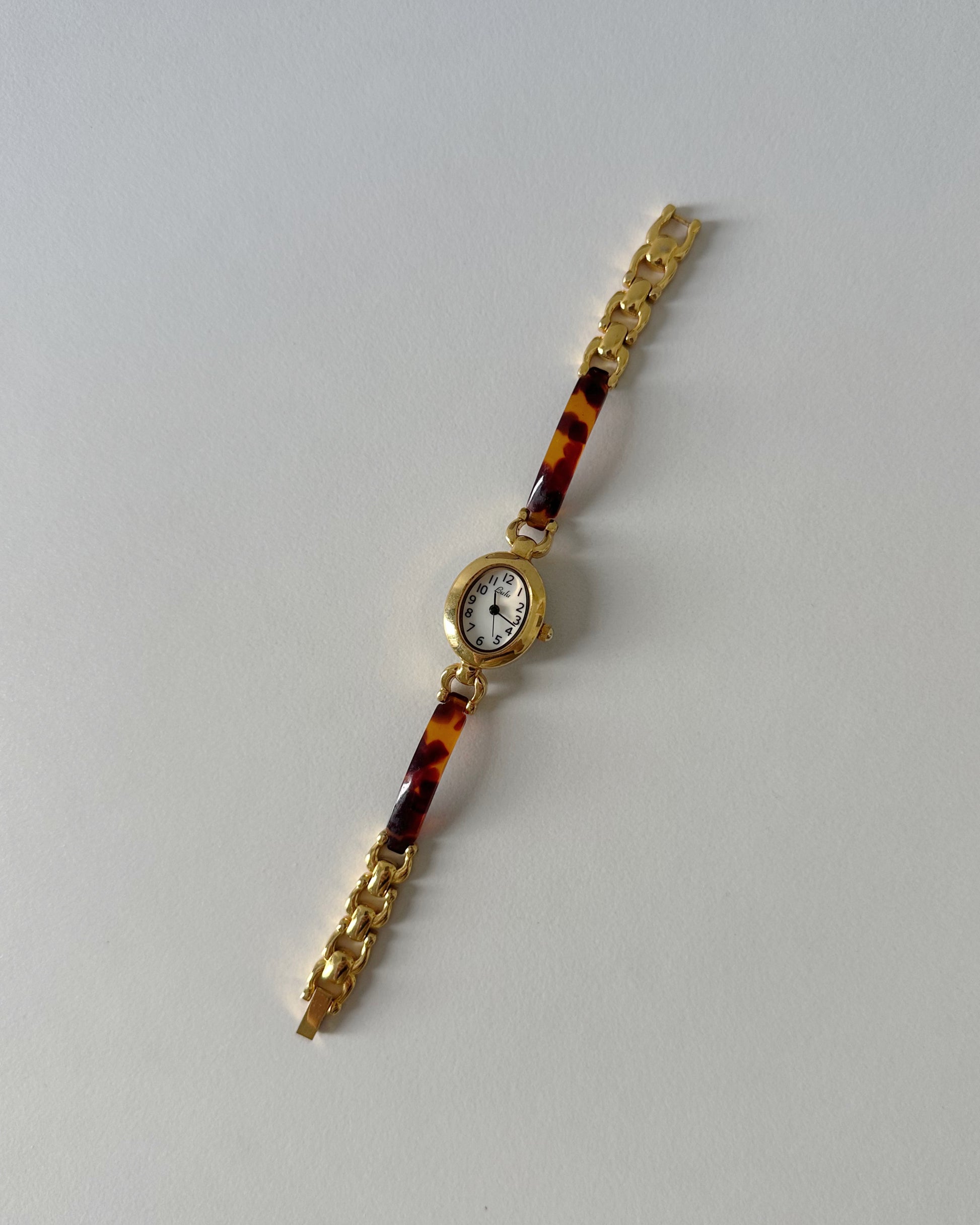 Oval Gold-Tone Tortoise Shell Bracelet Watch