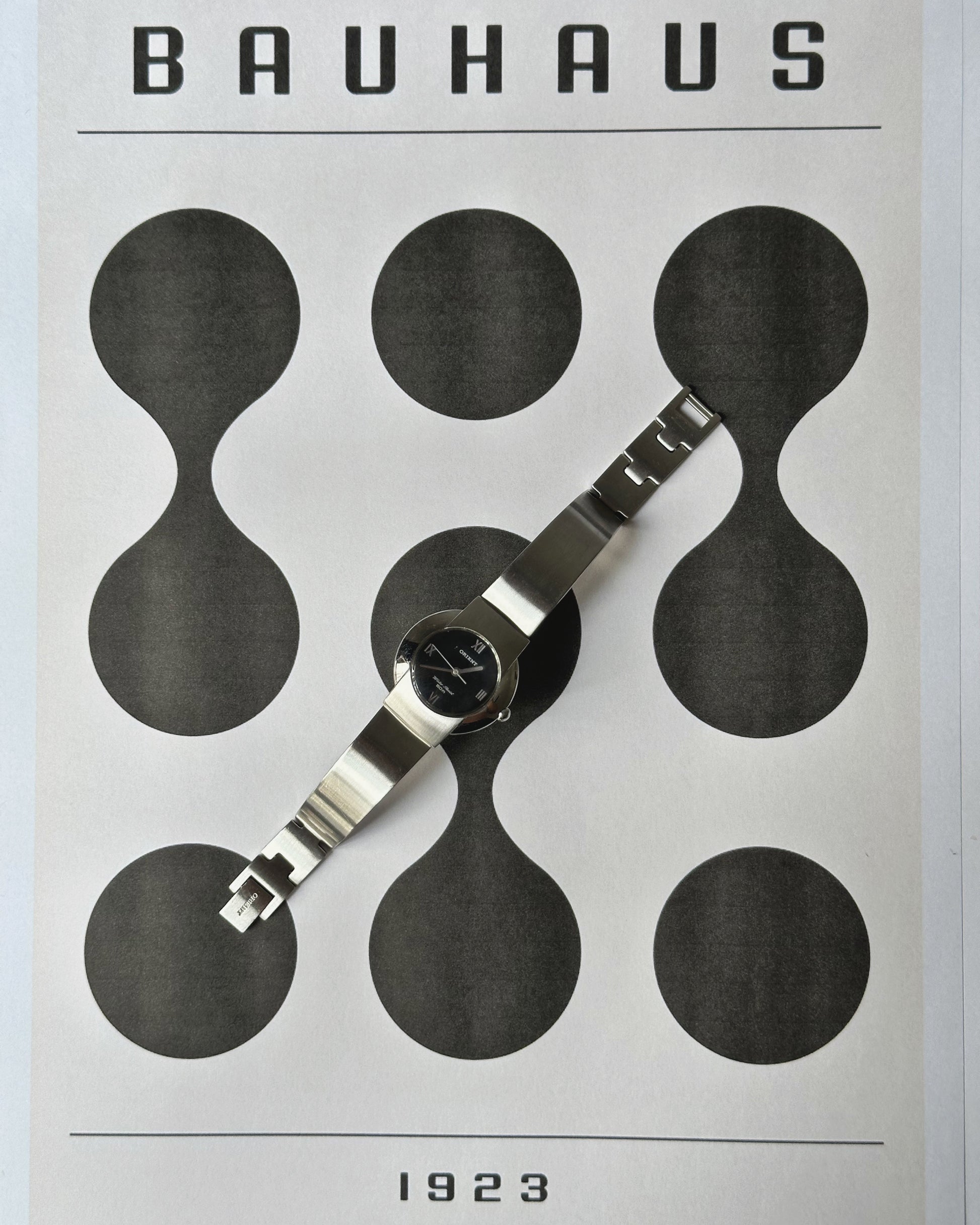 Silver tone Orient round dial watch