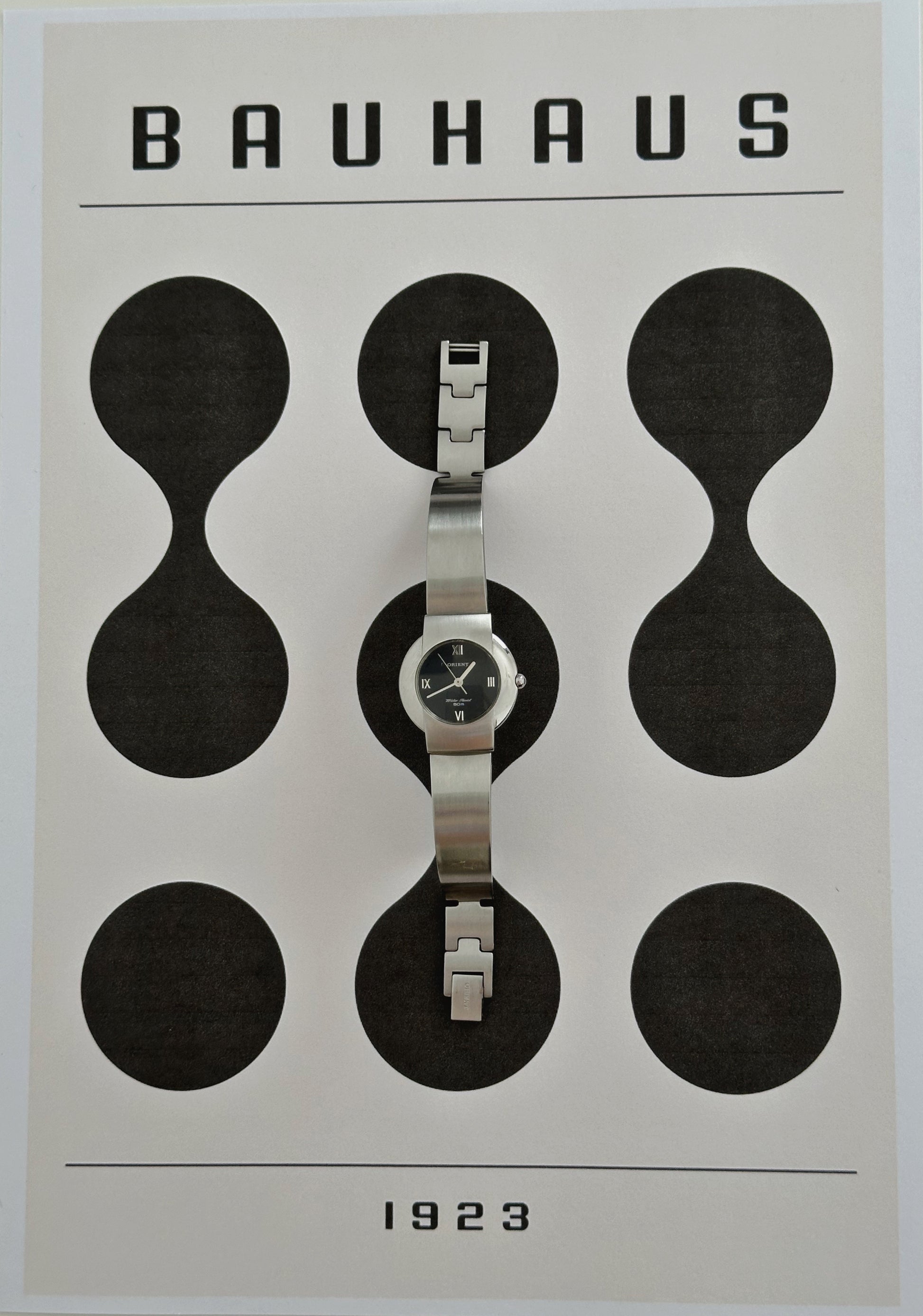 Silver tone Orient round dial watch bauhaus style