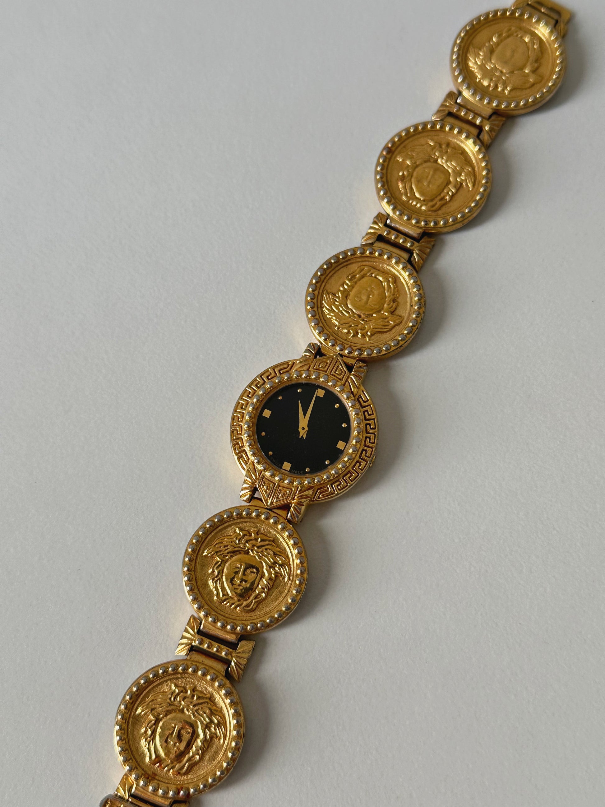Signature vintage watch from versace with medusa head 